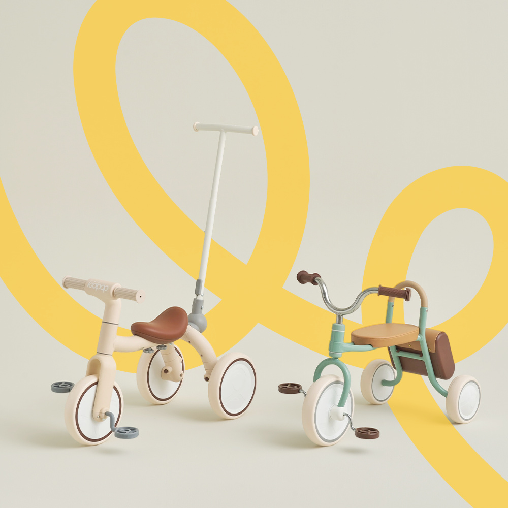 Comparison of Kidpop 3-in-1 toddler tricycle with push handle and a vintage-style mint green trike.