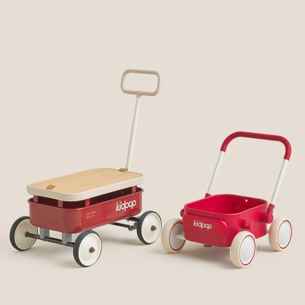A large red Kidpop wagon with a wood lid next to a smaller red toy wagon.